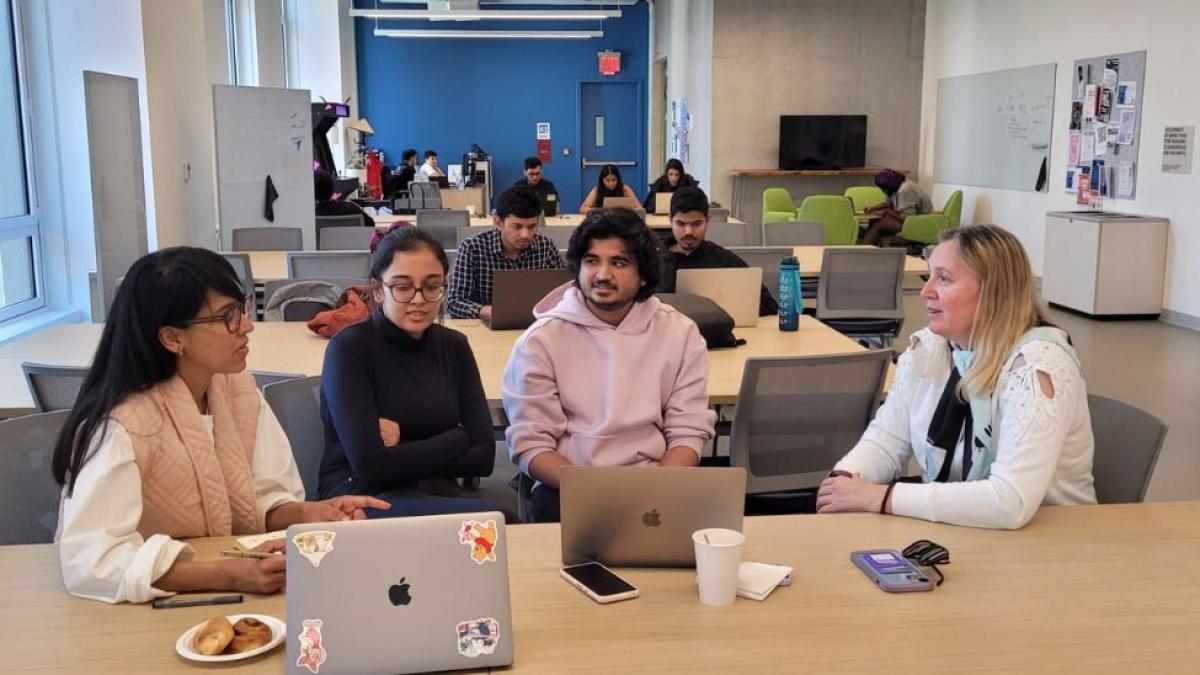 Pace professor Dr. Christelle Scharff mentoring a group of students for the NY Climate Exchange AI Innovation Challenge in the Seidenberg Design Factory. 