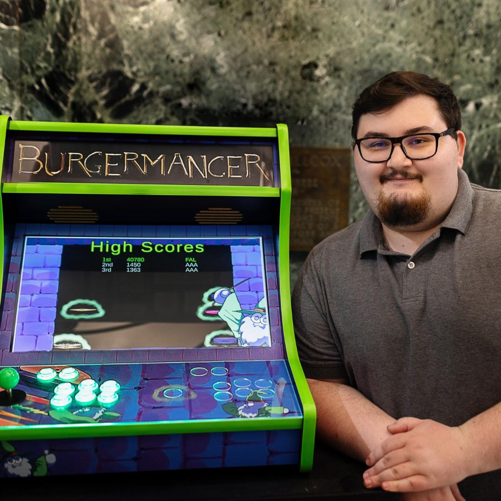 Pace University Seidenberg student, Michael Falco with his arcade video game, Burgermancer