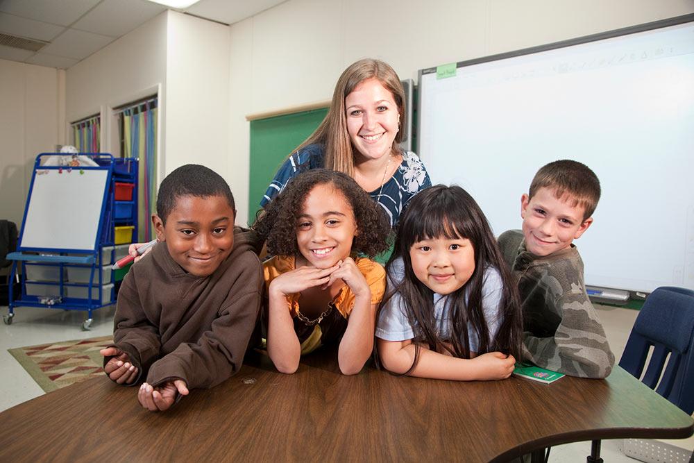 School of Education student working with children in a classroom.