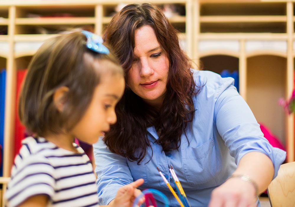 School of Education student working with children in a classroom.