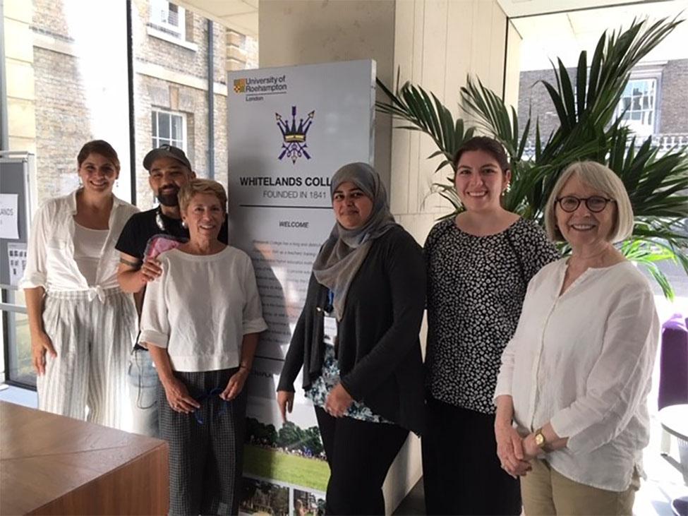 Four female and one male students standing with Dr. Barbara Mowder at the 2019 International Conference on Child and Adolescent Psychopathology (ICCAP): London, England.