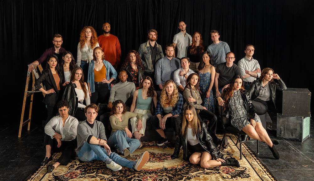 Group of Actors Studio Drama School students smiling at the camera.