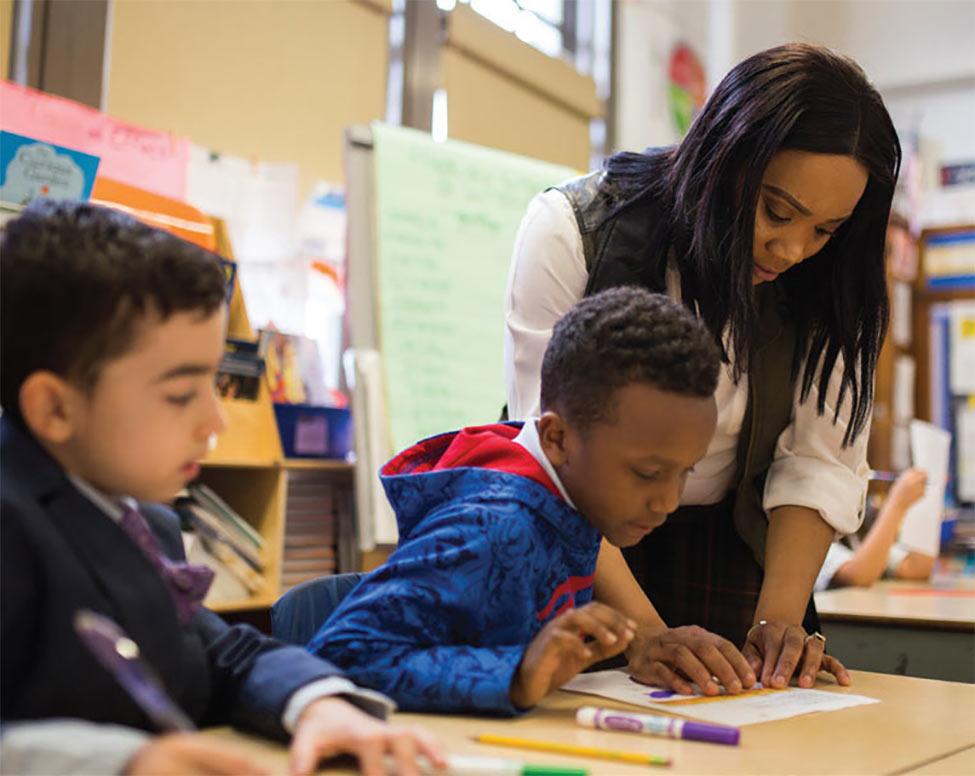 teacher with young students