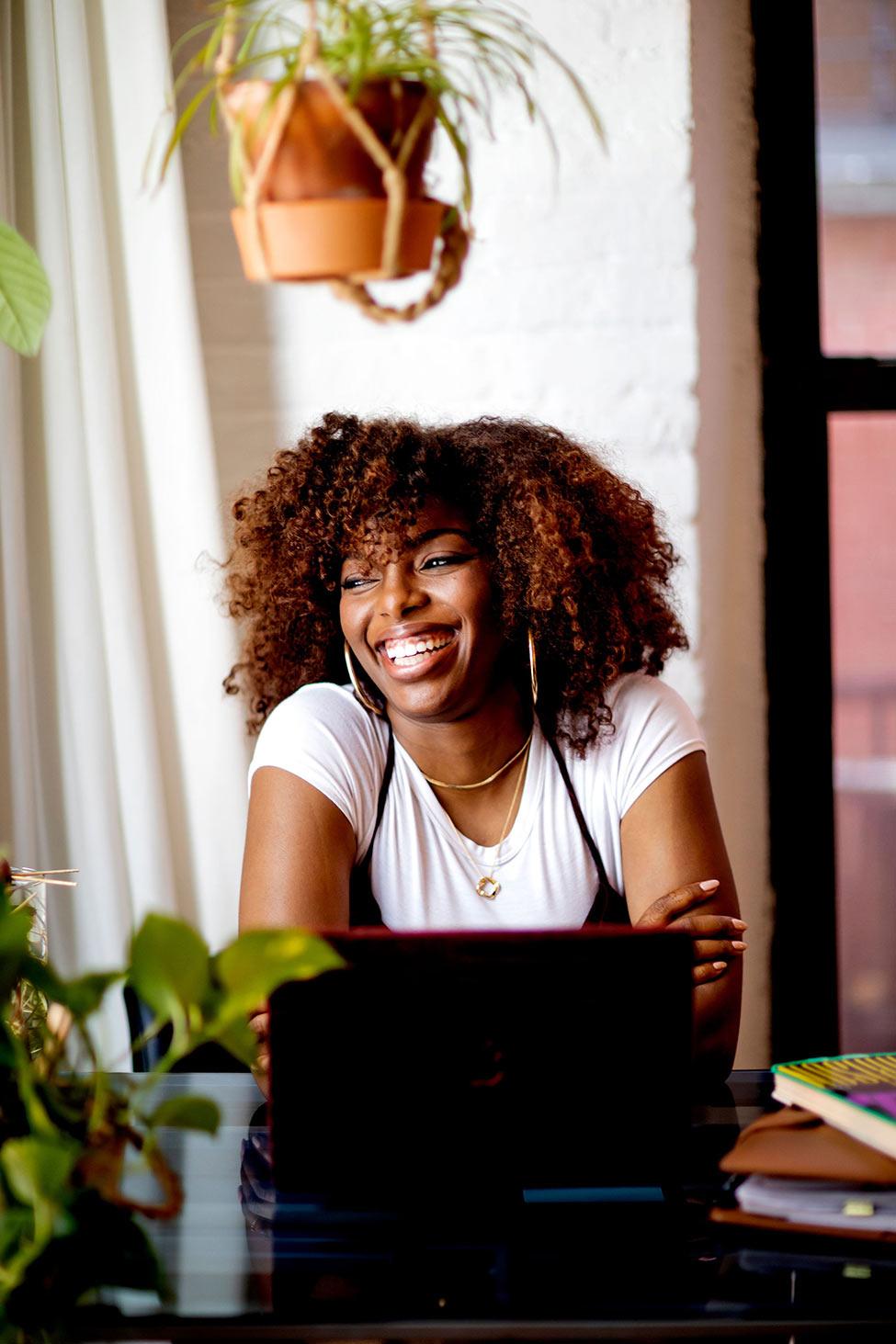 woman laughing looking away from camera 