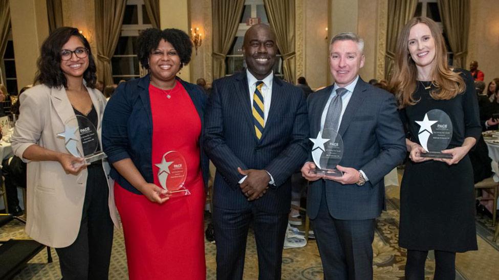 (Left to right) 2022 Rising Stars: Fatima Silva ’08, Cherie Phoenix-Sharpe ’07, Haub Law Dean Horace E. Anderson Jr., Kevin Sylvester ’14, Cayleigh Eckhardt ’15, Michael Bauscher ’10 (not pictured)