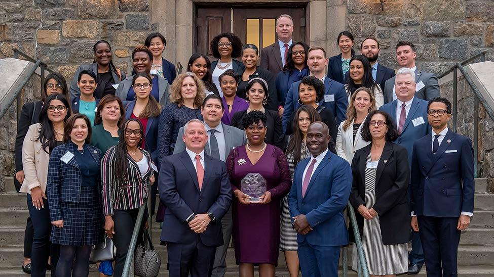 Members of the Office of the Bronx District Attorney with (front, middle) Robert S. Tucker, Chairman and CEO of T&M, Bronx District Attorney Darcel D. Clark, and Horace E. Anderson Jr., Dean of the Elisabeth Haub School of Law at Pace University.