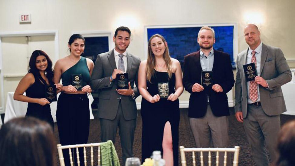 students and faculty at commencement celebration and awards