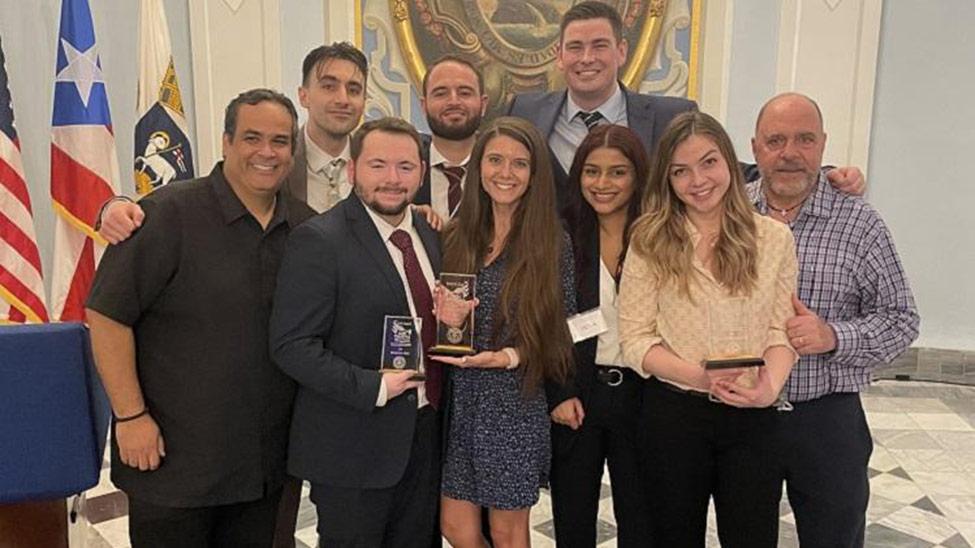 Pictured, from L to R: Carlos Concepción, Joseph Russo, Daniel Petrillo, Andre Ingenito, Giuliana Trivella, Phillip O’Meara, Krittika ‘Kye’ Shah, Alina Rizhinashvili, and Louis Fasulo 