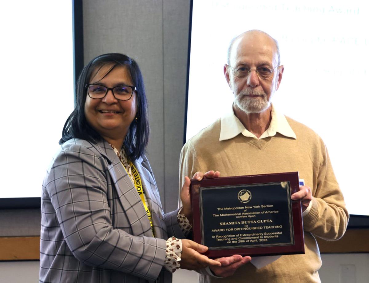 Shamita Dutta Gupta accepting the Mathematical Association of America (MAA) Distinguished Teaching Award