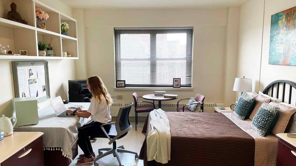 student at desk in room in Dannat Hall at Elisabeth Haub School of Law, White Plains, NY