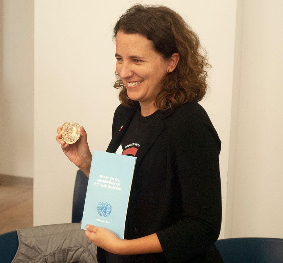 Pace University's faculty member Emily Welty, PhD holding the Nobel peace prize