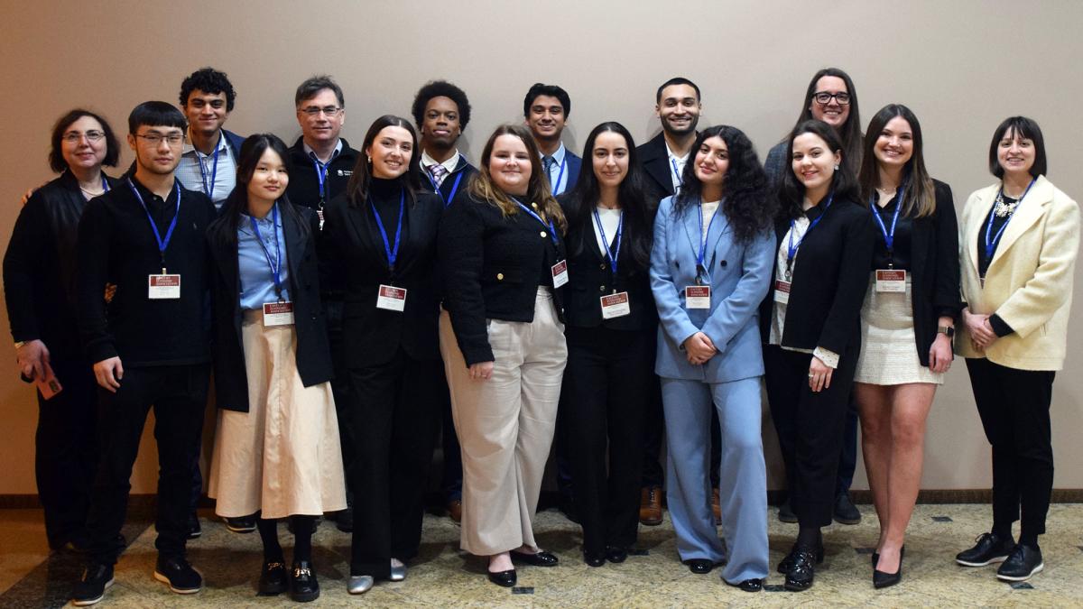 Five Pace University Dyson Economics Department faculty and 10 undergraduate and graduate students, all Dyson economics and business economics majors all standing together, presented their research papers at the annual Eastern Economic Association (EEA) conference in Boston