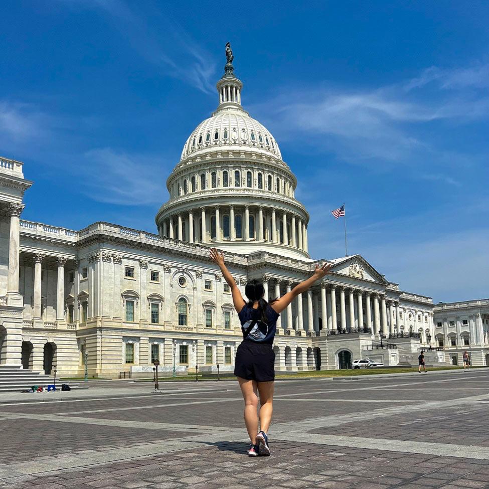 Elisabeth Haub School of Law student ThuLan Pham standing in front of the DC Capitol Buildling