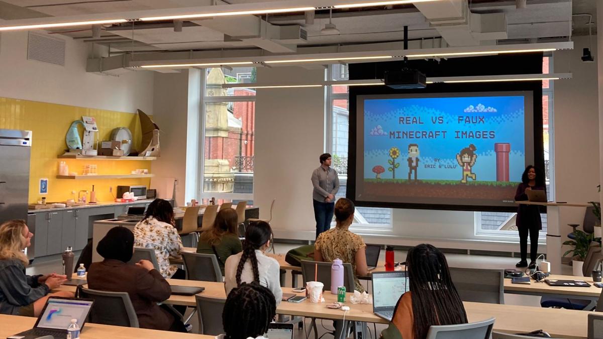 Two Seidenberg School of CSIS students presenting a Powerpoint of their project about AI-generated Minecraft images to the rest of the interns at the AI Internship Experience.