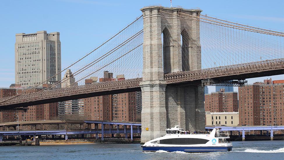 nyc waterway with view of the Brooklyn Bridge