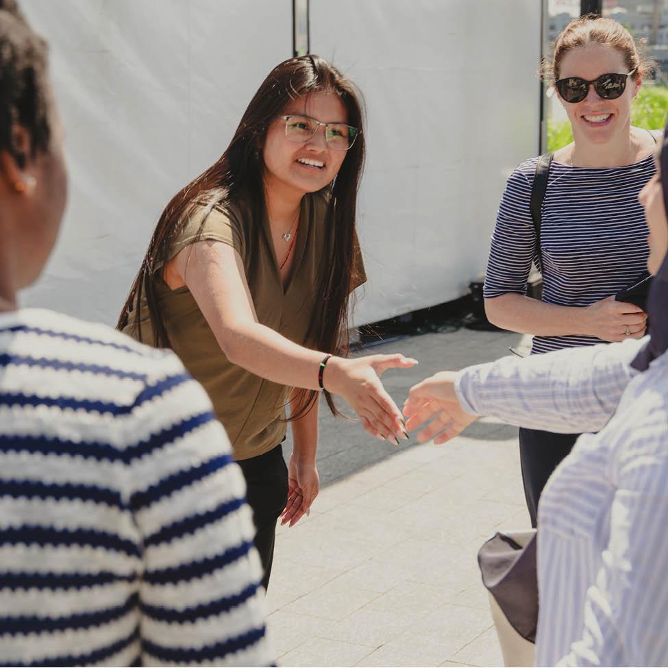 Ste[hanie greets Pace U Wilson Center Summer Interns at South Street Seaport