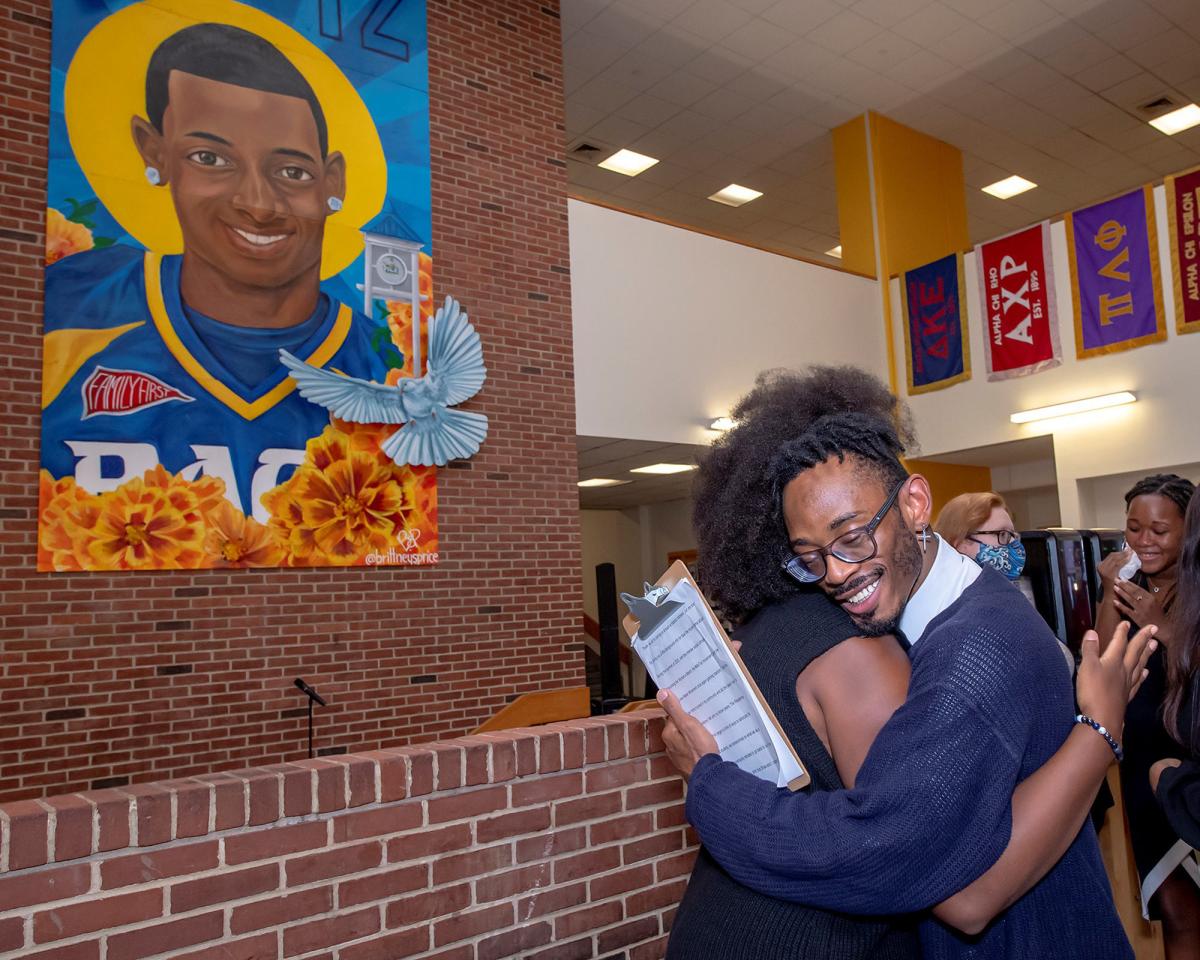 Pace students and artist at the unveiling of the DJ Henry mural in 2021 displayed in the Kessel Student Center in Pleasantville.