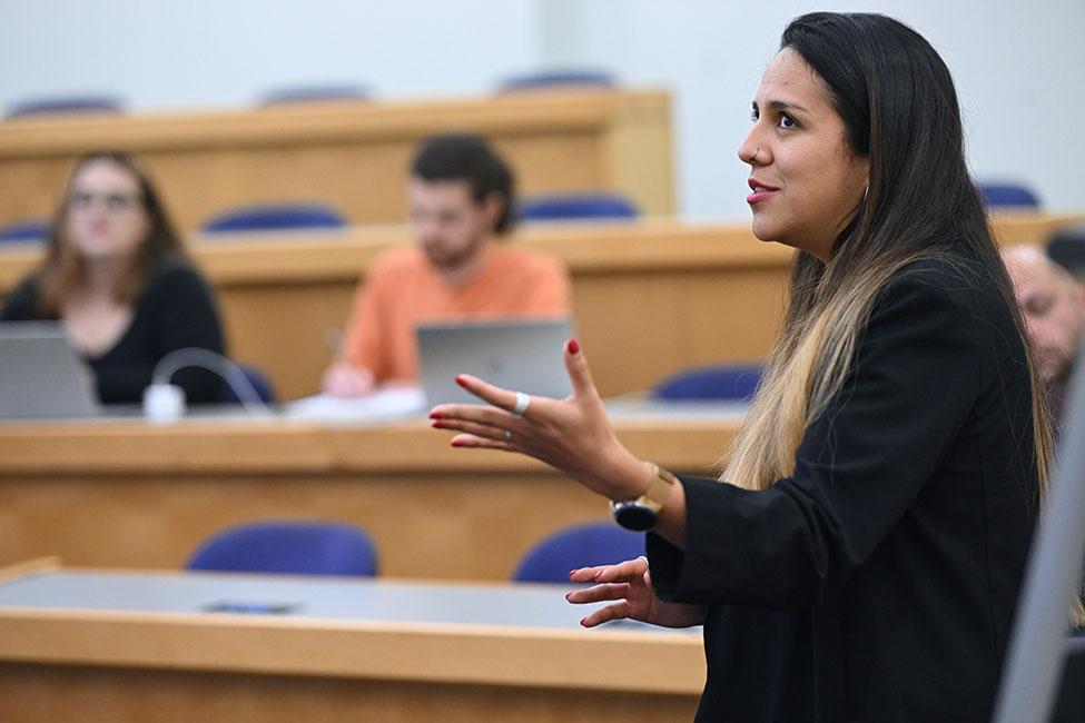 Camila Bustos lecturing to Haub Law students. 