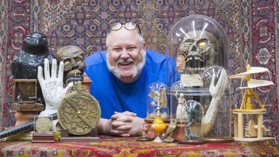 Jay Duckworth, an associate clinical professor of theater at Pace University’s Sands College of Performing Arts, posing with several of his props.