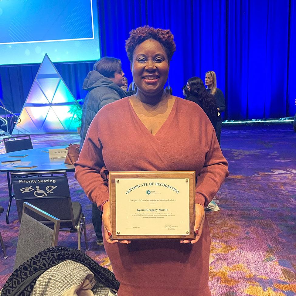 College of Health Professions Professor Kyomi Gregory-Martin with her Award for Special Contributions in Multicultural Affairs.