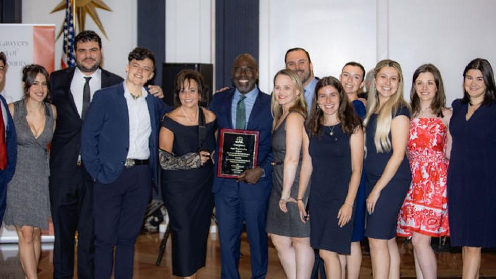Elisabeth Haub School of Law at Pace University Dean Horace Anderson with Angie D'Agostino holding award and pictured with law students