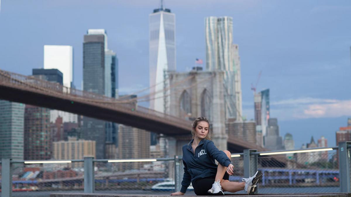 woman in a yoga pose at the south street seaport