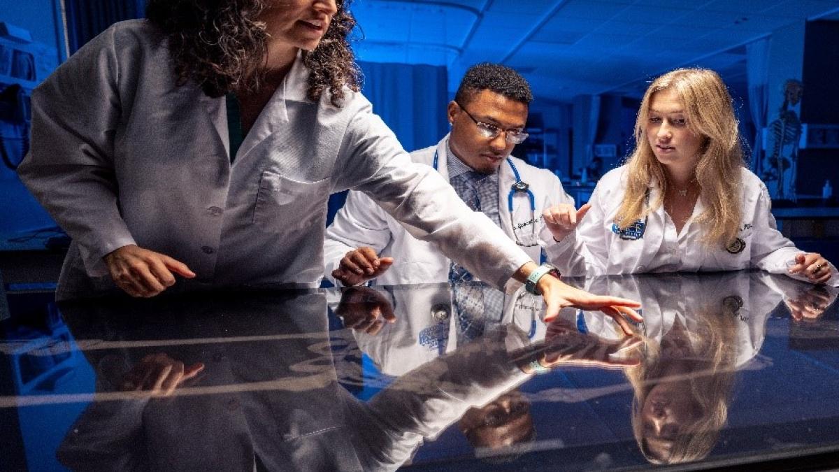 Professor and students in a lab 