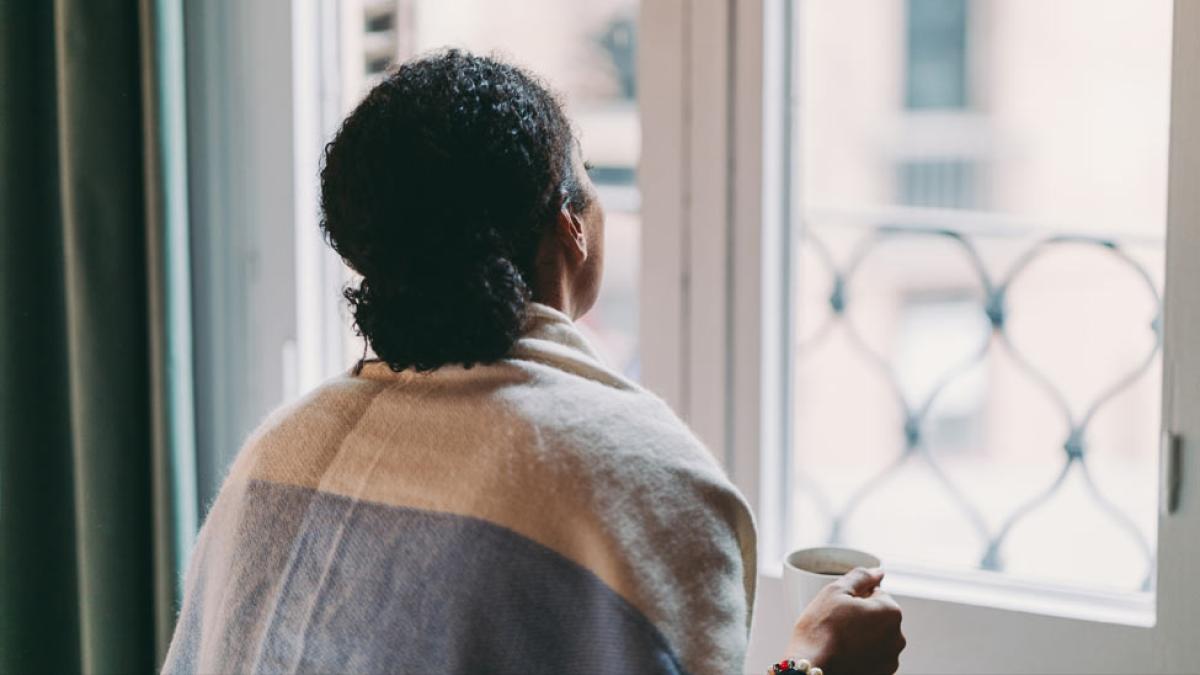 woman looking out window