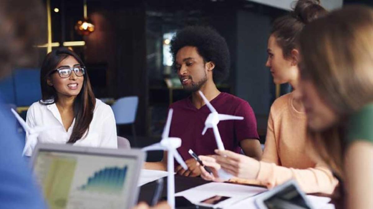 students collaborating around a conference table