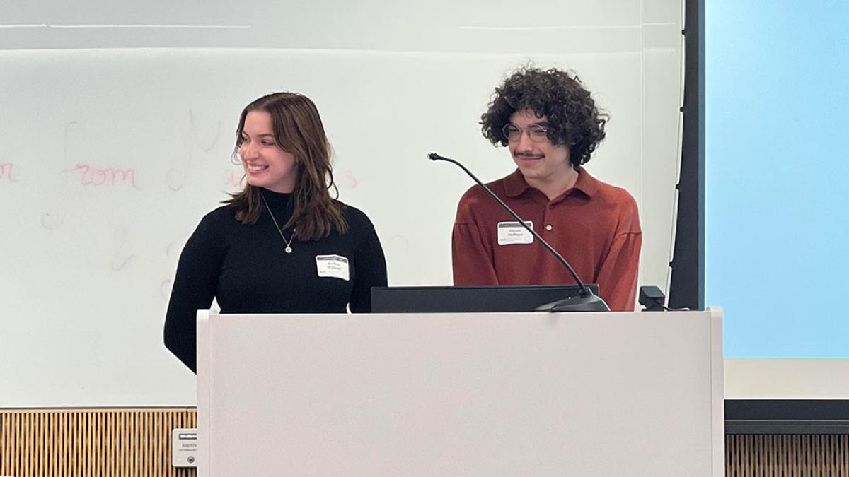 Pace University students Kalina Walaski and Dante Dallago at a podium