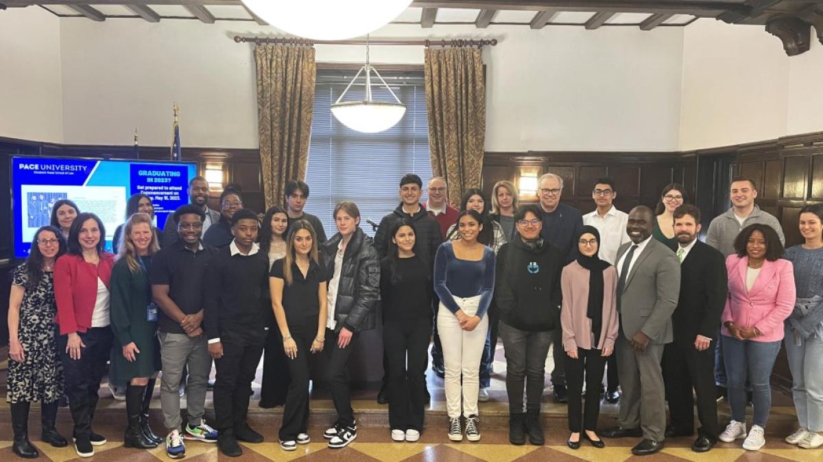 Group photo in the Tudor Room of Haub Law