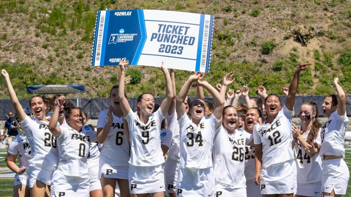 Pace women's lacrosse team celebrating their win over Adelphi