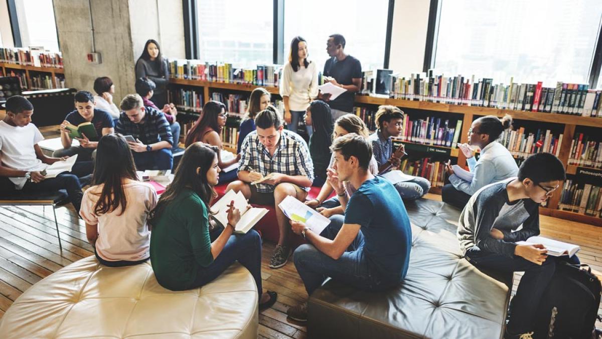 Students collaborating in a library study space