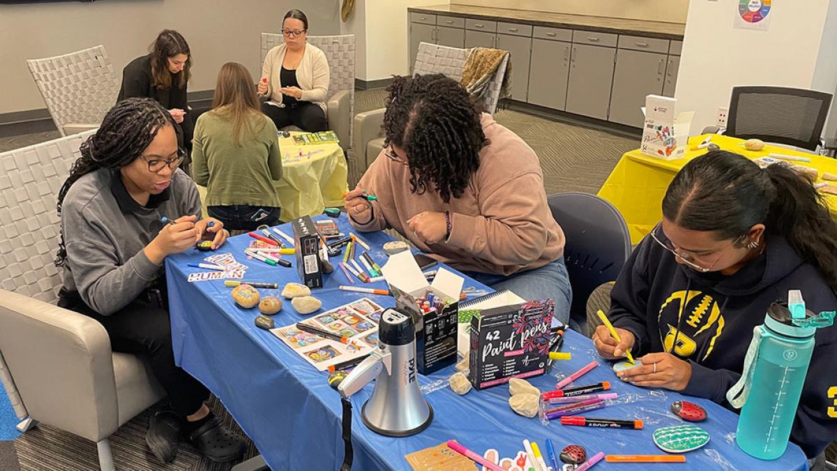 Pace first generation students participate in a painting activity