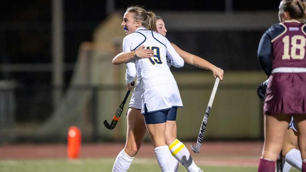 Field Hockey players Noelle Meij and Krista Dietz celebrating a goal 