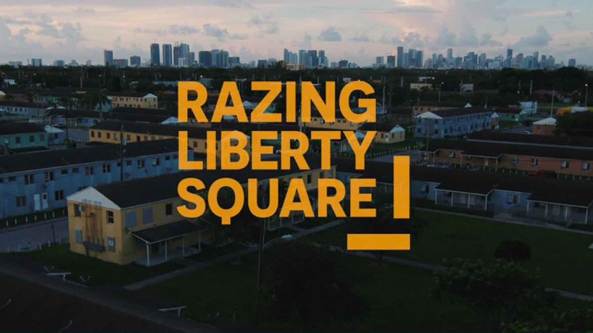 Orange text reading "Razing Libert Square" is overlayed over Liberty City in Miami Florida 