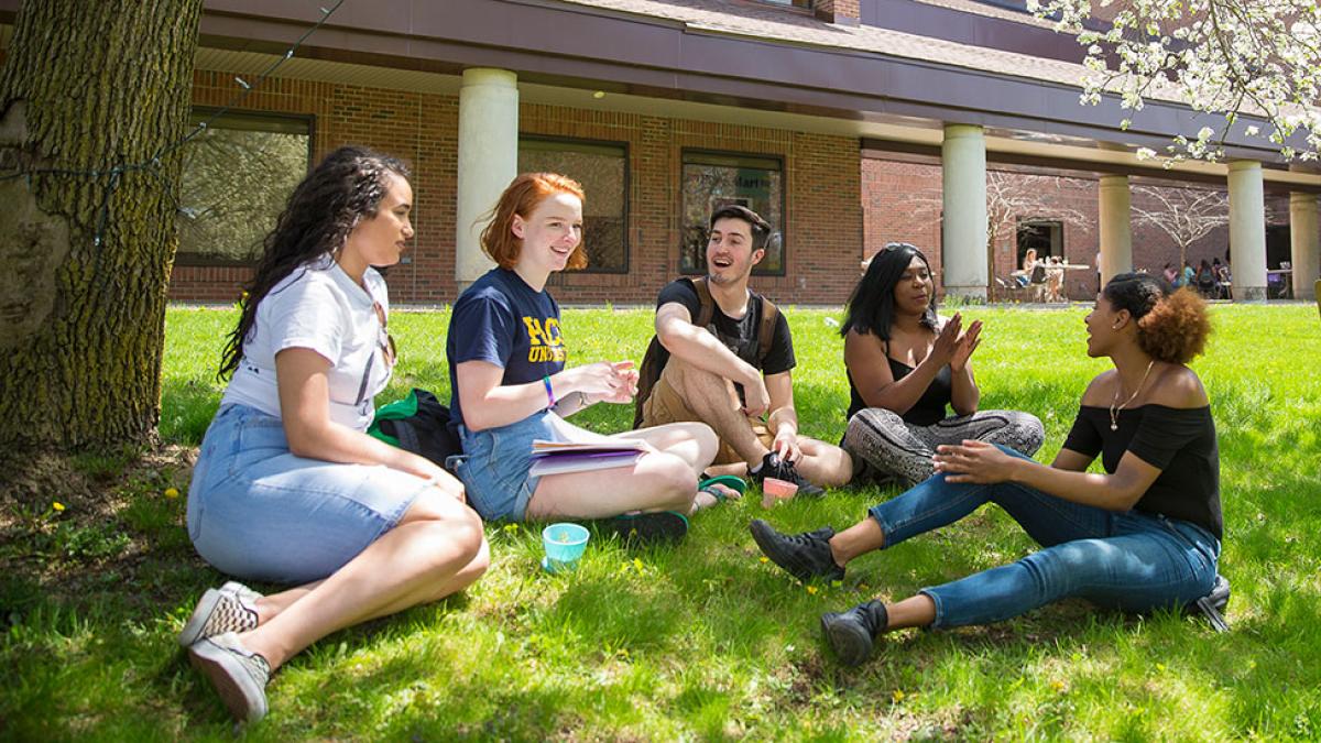 Students meeting on the lawn in front of Mortola Library on the Pace University campus