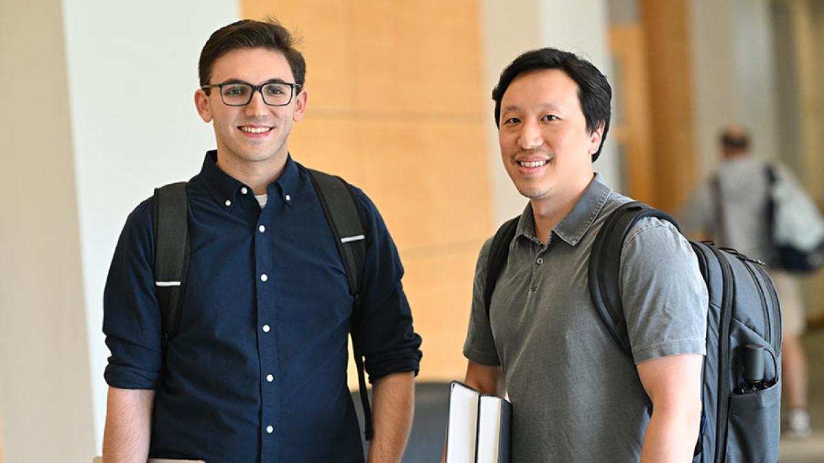 Two male students in hallway