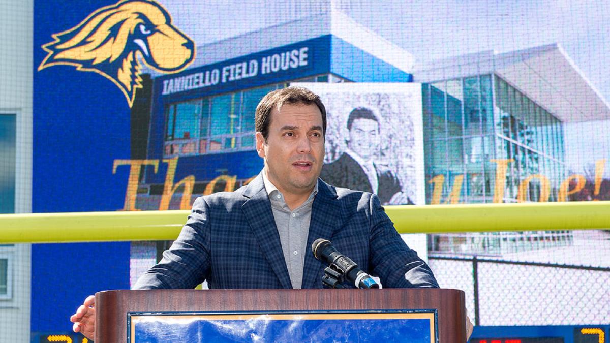 Joe Ianniello standing at a podium addressing the Pace Community. 