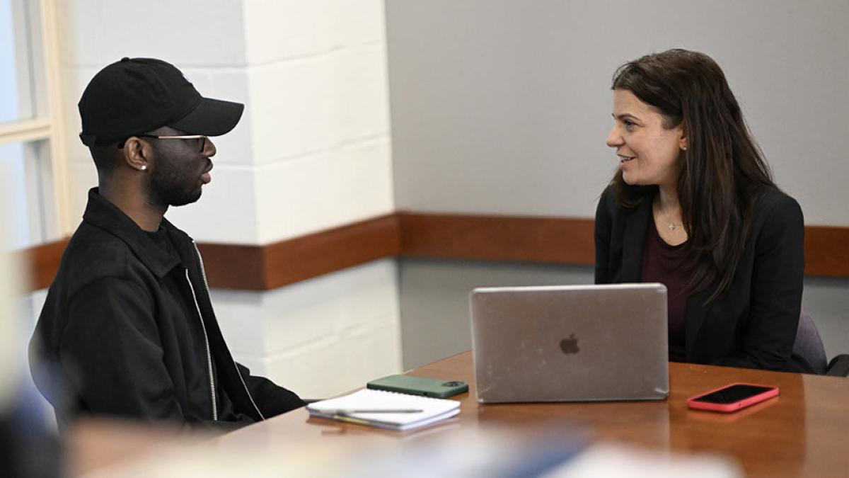 professor and student talking at table, Elisabeth Haub School of Law at Pace University