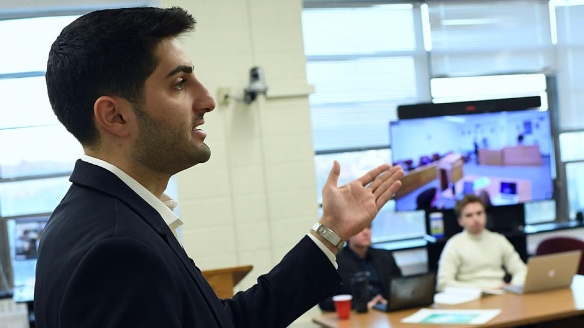 A professor at the Elisabeth Haub School of Law, speaking to a classroom of students.