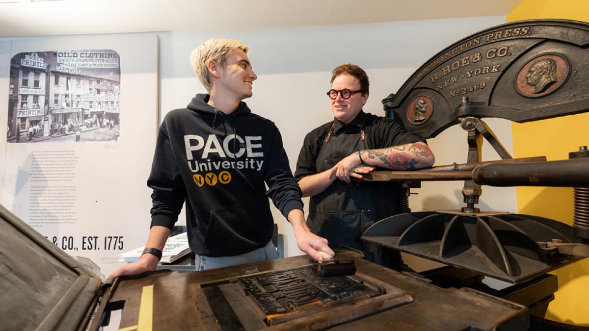 Pace student and teacher at South Street Seaport printing press