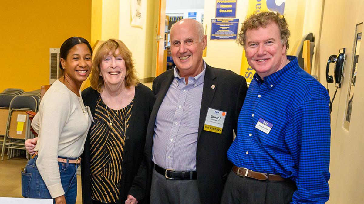 Pace University alumni smiling at the camera at the Golden Graduates Brunch.