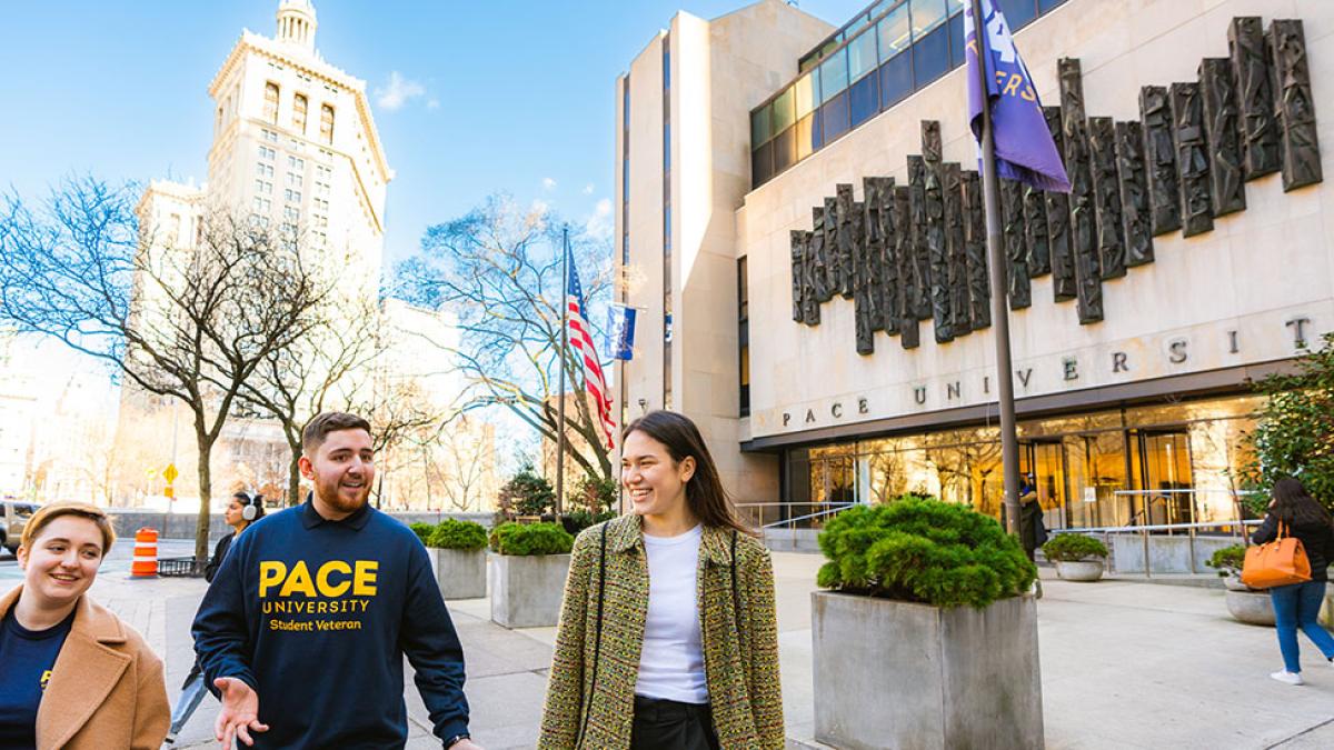 Pace University students walking by the entrance of One Pace Plaza in New York City