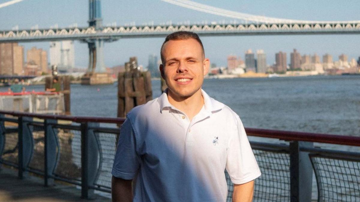 Pace Seidenberg student Fabian Hiller posing for a photo on a pier by the New York City waterfront.