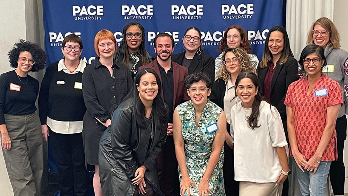 Group of Pace University's Women's and Gender Studies faculty, students, and alumni standing together