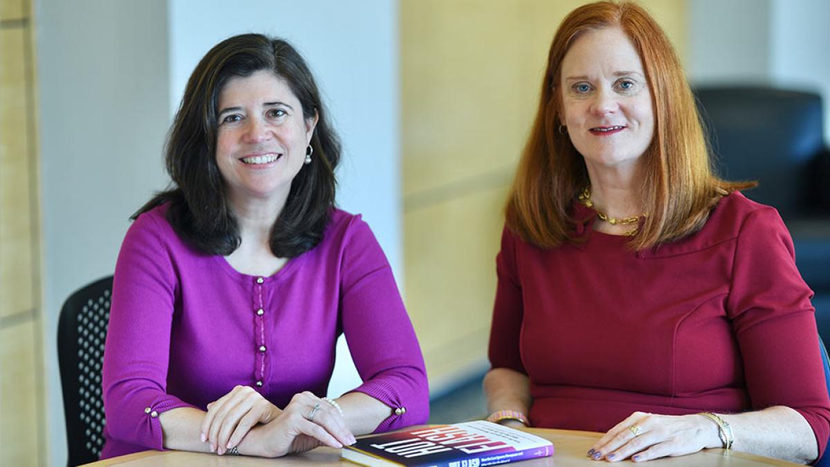 Elisabeth Haub School of Law Professors Emily Gold Waldman and Professor Bridget J. Crawford with their book, Hot Flash.