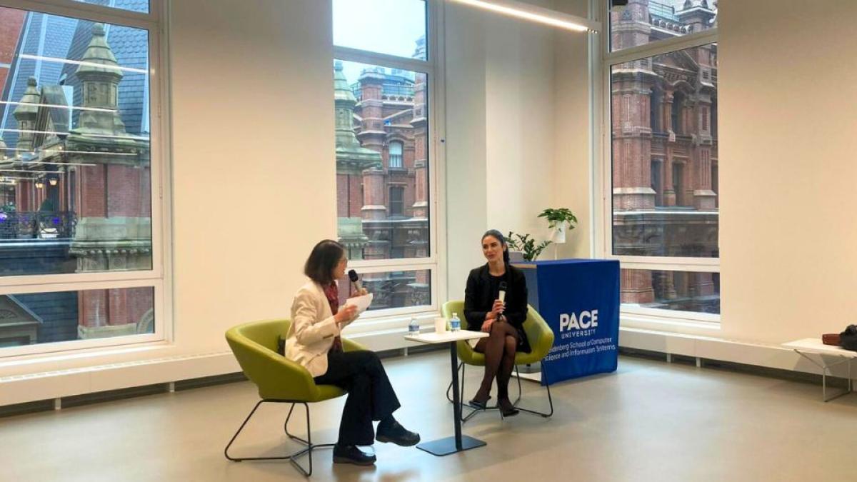 Pace University Seidenberg Interim Dean Li-Chiou Chen having a conversation with Emilie Nasseh at the Design Factory space.