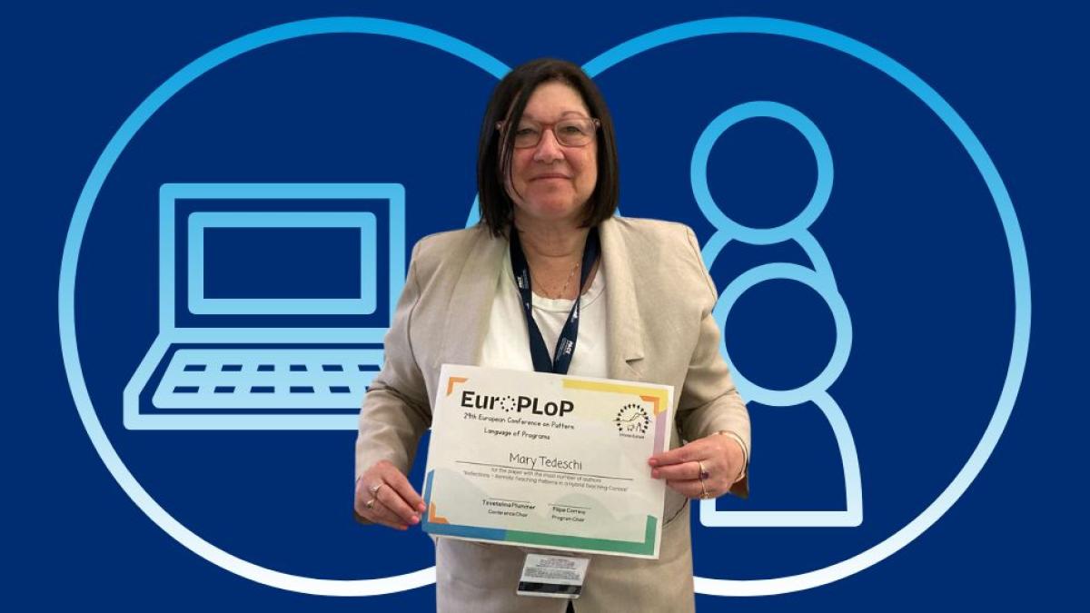 Pace University Seidenberg Professor Mary Tedeschi posing for a photo with her conference certificate.