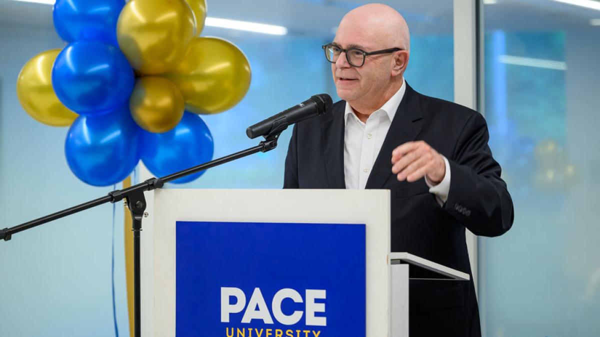 Pace University Alumni, Gary Laermer '80 at a podium.